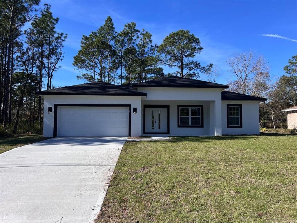 Front exterior of a new home in , Citrus Springs, FL, highlighting curb appeal (Image 1). Front exterior of a new home in , Citrus Springs, FL, highlighting curb appeal (Image 1).