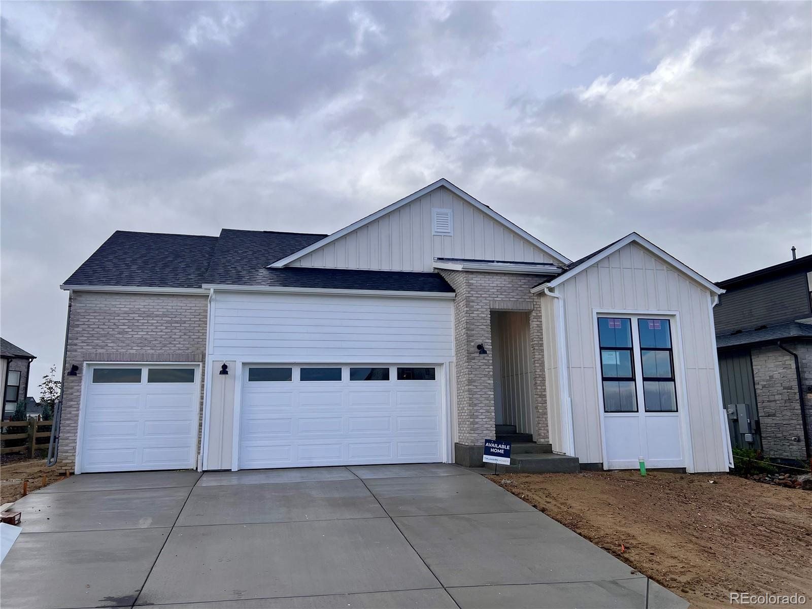 Front exterior of a new home in Kitchel Lake at Serratoga Falls, Timnath, CO, highlighting curb appeal (Image 1).