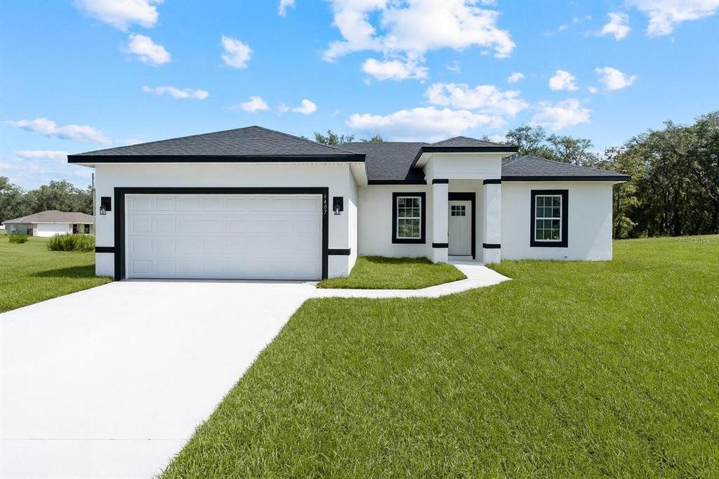 Front exterior of a new home in , Ocala, FL, highlighting curb appeal (Image 1). Front exterior of a new home in , Ocala, FL, highlighting curb appeal (Image 1).