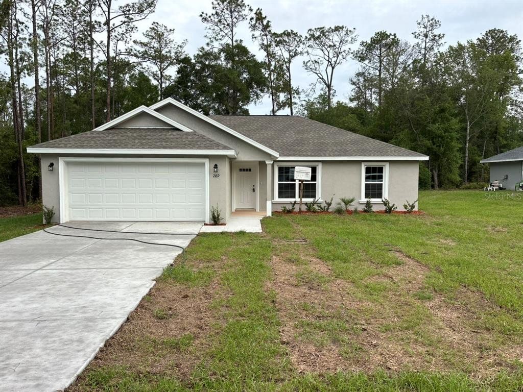 Front exterior of a new home in , Dunnellon, FL, highlighting curb appeal (Image 1). Front exterior of a new home in , Dunnellon, FL, highlighting curb appeal (Image 1).