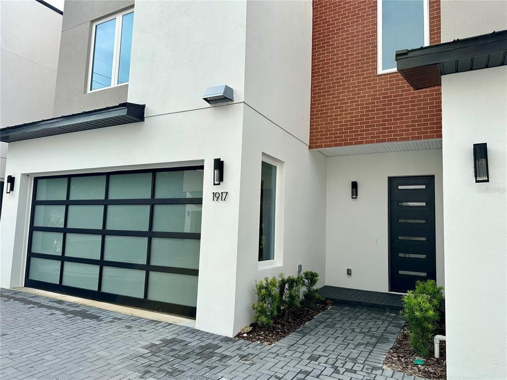 Front exterior of a new home in , Winter Park, FL, highlighting curb appeal (Image 1). Front exterior of a new home in , Winter Park, FL, highlighting curb appeal (Image 1).