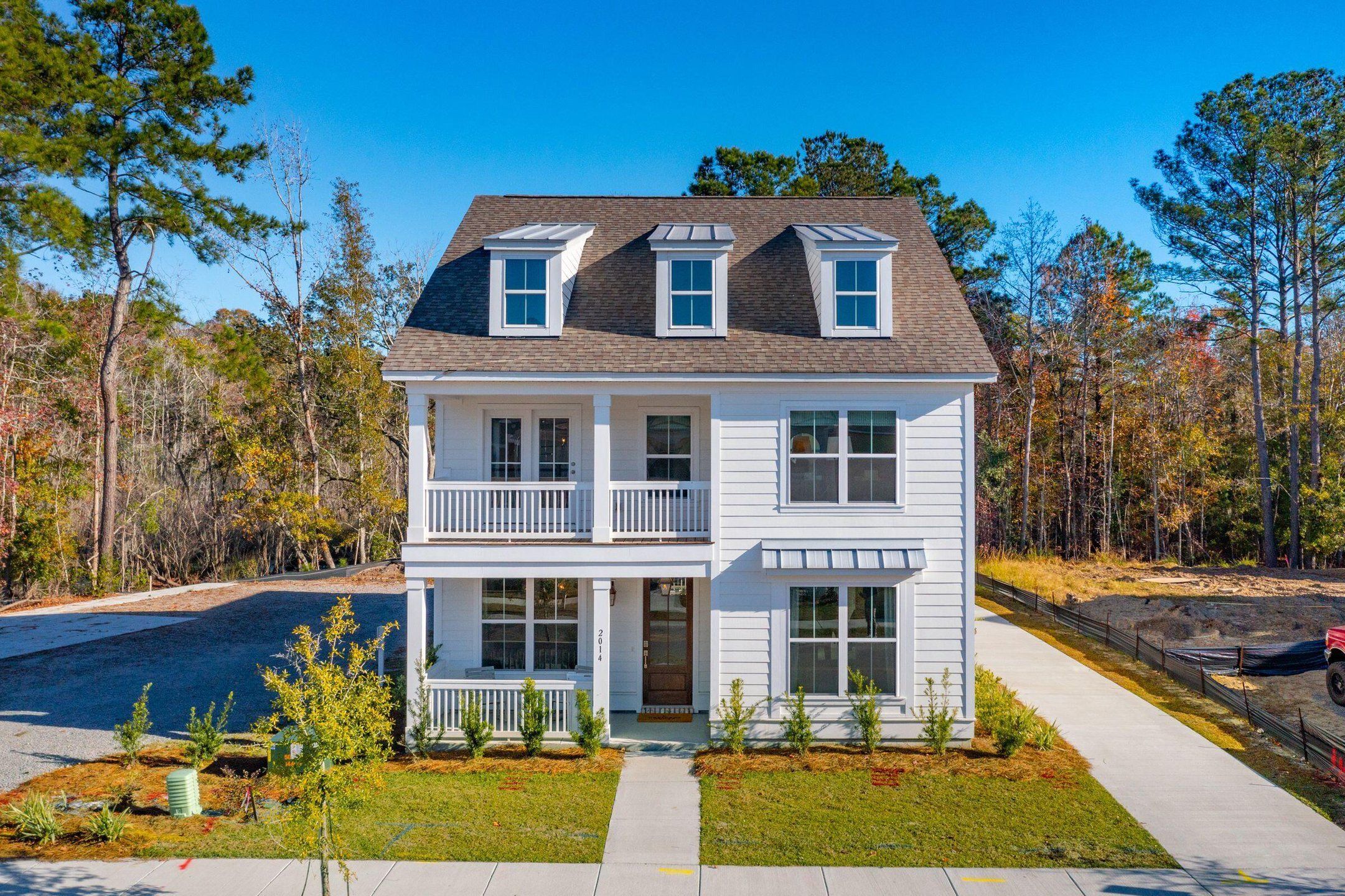 Front exterior of a new home in Twin Lakes, Johns Island, SC, highlighting curb appeal (Image 1). Front exterior of a new home in Twin Lakes, Johns Island, SC, highlighting curb appeal (Image 1).
