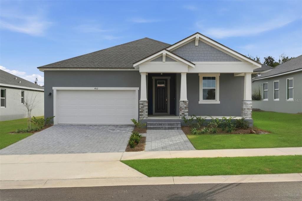 Front exterior of a new home in Rainwood, Groveland, FL, highlighting curb appeal (Image 1). Front exterior of a new home in Rainwood, Groveland, FL, highlighting curb appeal (Image 1).
