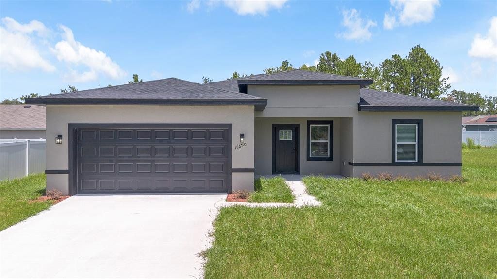 Front exterior of a new home in , Ocala, FL, highlighting curb appeal (Image 1). Front exterior of a new home in , Ocala, FL, highlighting curb appeal (Image 1).