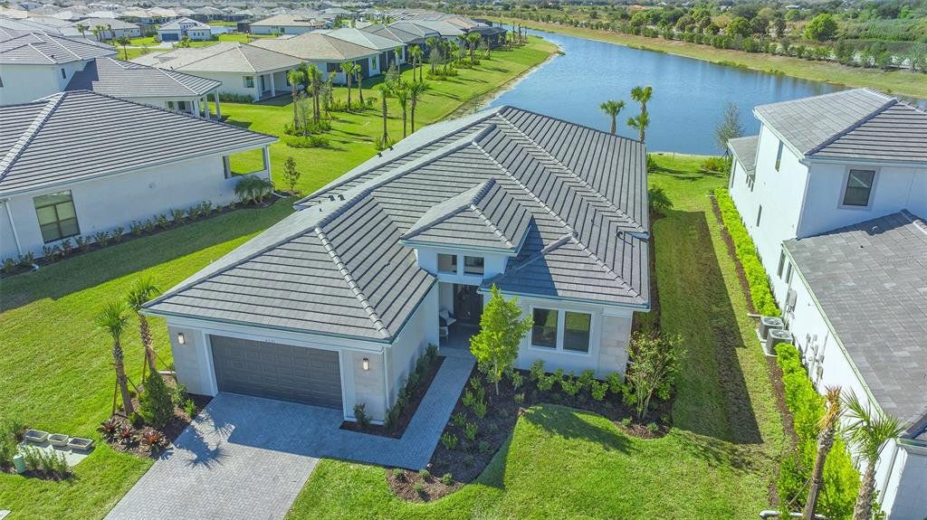Front exterior of a new home in , Sarasota, FL, highlighting curb appeal (Image 1). Front exterior of a new home in , Sarasota, FL, highlighting curb appeal (Image 1).