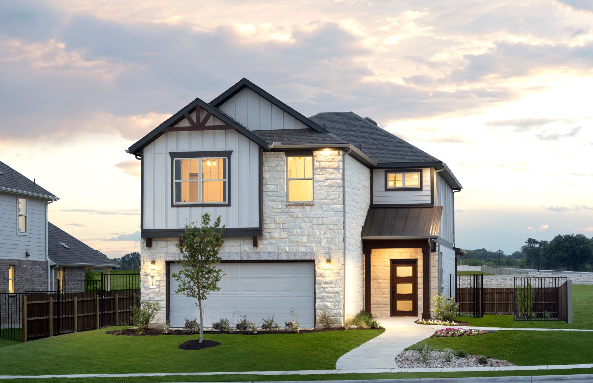 Front exterior of a new home in Santa Rita Ranch, Liberty Hill, TX, highlighting curb appeal (Image 1). Front exterior of a new home in Santa Rita Ranch, Liberty Hill, TX, highlighting curb appeal (Image 1).