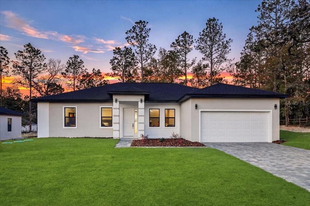 Front exterior of a new home in , Citrus Springs, FL, highlighting curb appeal (Image 1). Front exterior of a new home in , Citrus Springs, FL, highlighting curb appeal (Image 1).