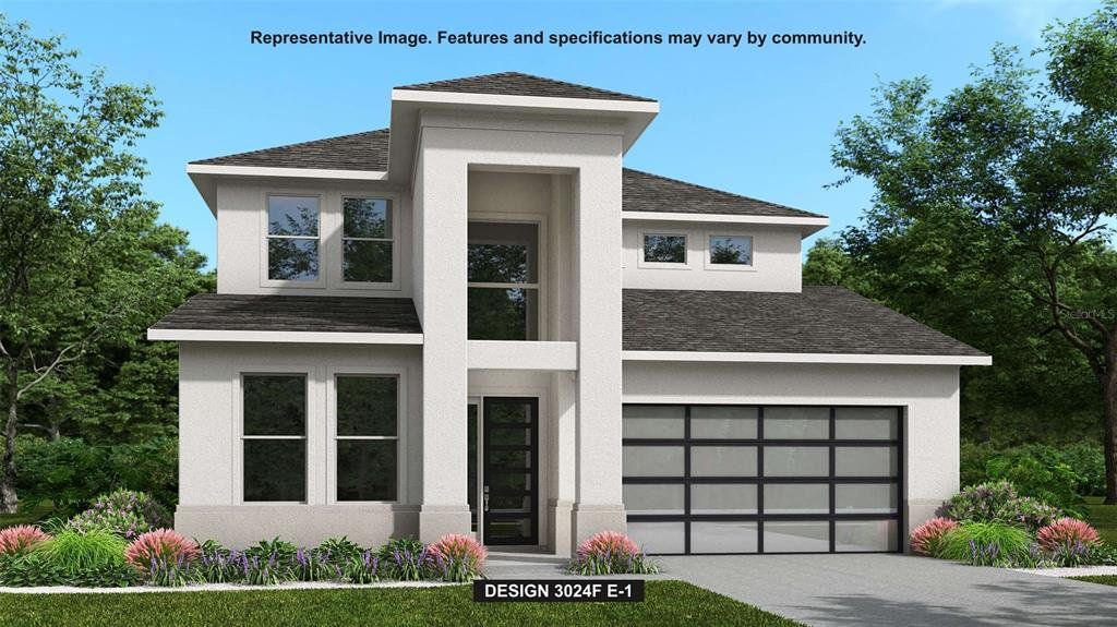 Front exterior of a new home in Star Farms at Lakewood Ranch, Bradenton, FL, highlighting curb appeal (Image 1). Front exterior of a new home in Star Farms at Lakewood Ranch, Bradenton, FL, highlighting curb appeal (Image 1).