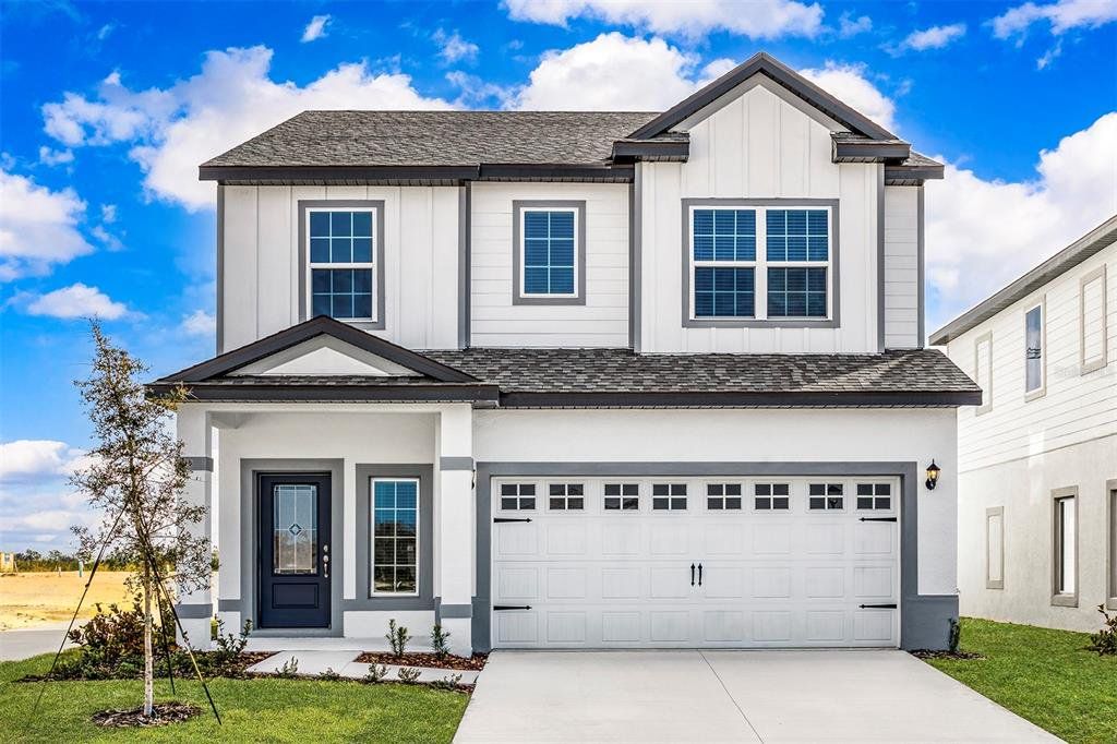 Front exterior of a new home in Gum Lake Preserve, Lake Alfred, FL, highlighting curb appeal (Image 1). Front exterior of a new home in Gum Lake Preserve, Lake Alfred, FL, highlighting curb appeal (Image 1).