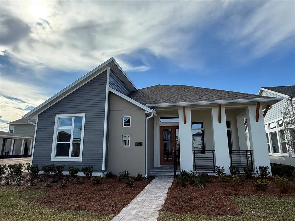 Front exterior of a new home in Laureate Park, Orlando, FL, highlighting curb appeal (Image 1). Front exterior of a new home in Laureate Park, Orlando, FL, highlighting curb appeal (Image 1).