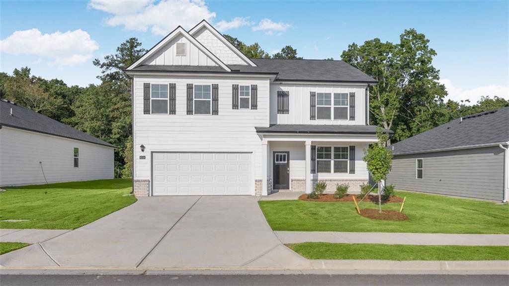 Front exterior of a new home in The Preserve at Agricultural Village, Perry, GA, highlighting curb appeal (Image 1). Front exterior of a new home in The Preserve at Agricultural Village, Perry, GA, highlighting curb appeal (Image 1).