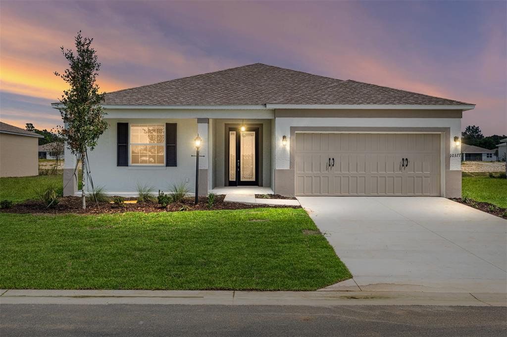 Front exterior of a new home in On Top of the World Communities, Ocala, FL, highlighting curb appeal (Image 1). Front exterior of a new home in On Top of the World Communities, Ocala, FL, highlighting curb appeal (Image 1).