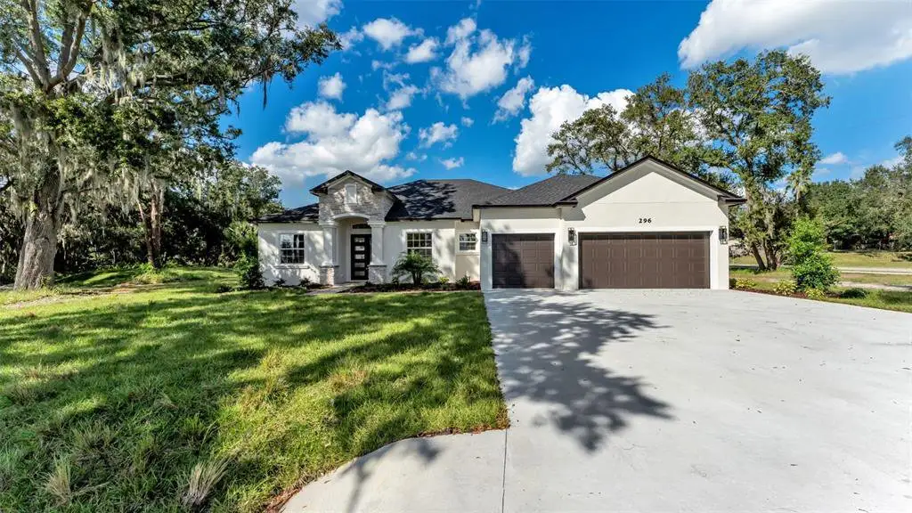 Front exterior of a new home in , Lakeland, FL, highlighting curb appeal (Image 1). Front exterior of a new home in , Lakeland, FL, highlighting curb appeal (Image 1).