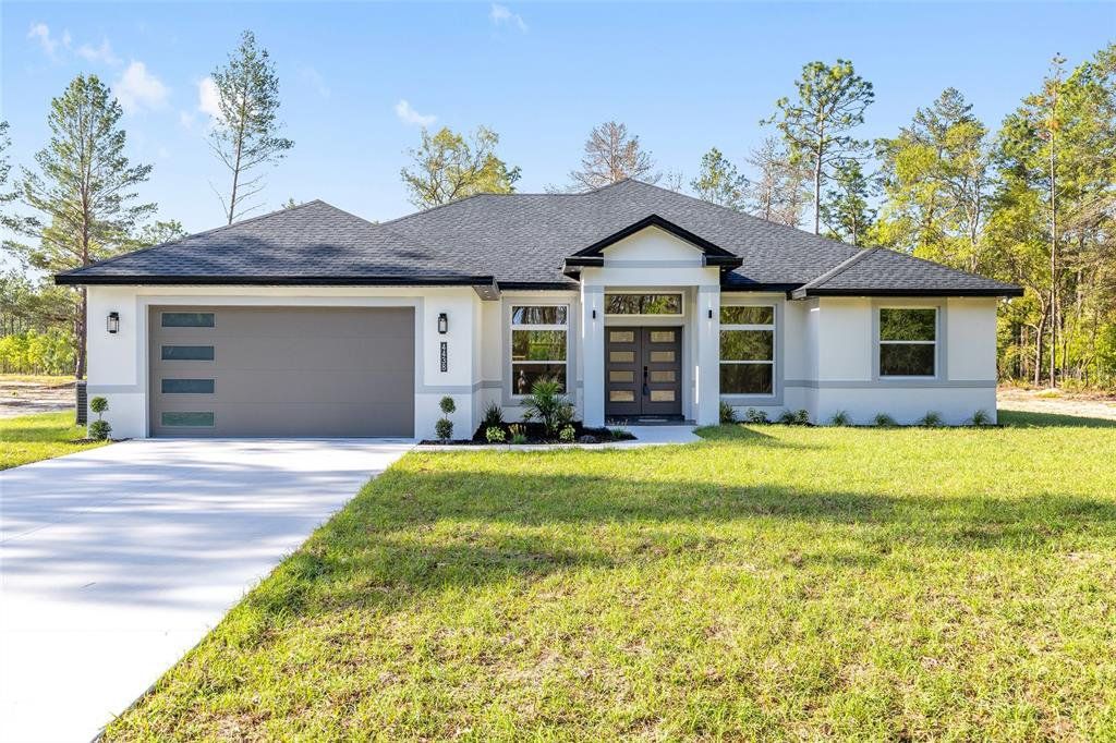 Front exterior of a new home in , Ocala, FL, highlighting curb appeal (Image 1). Front exterior of a new home in , Ocala, FL, highlighting curb appeal (Image 1).
