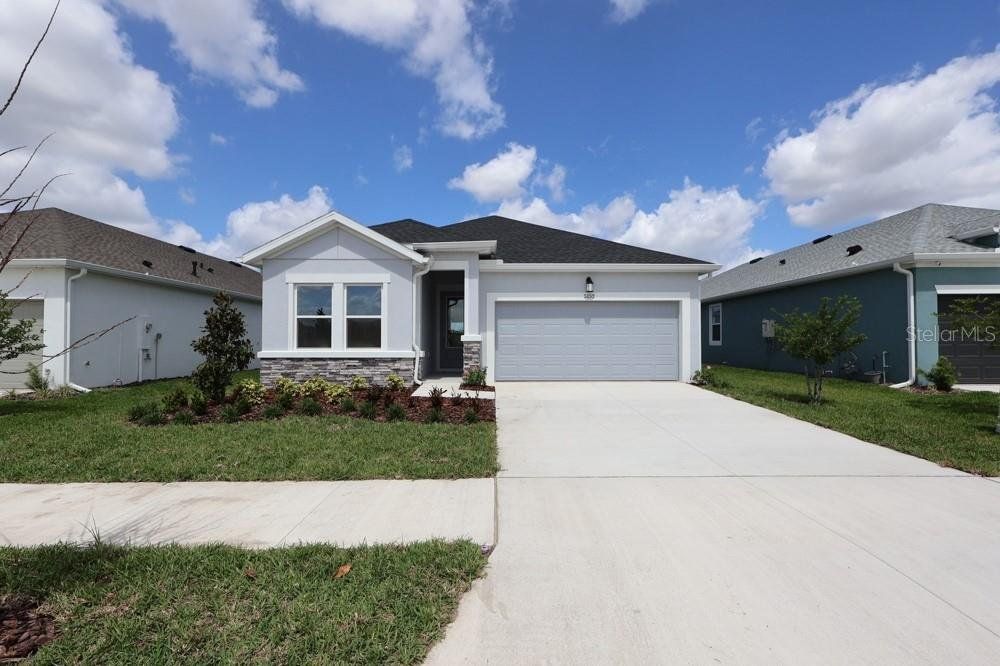 Front exterior of a new home in Waterset Tradition Series, Apollo Beach, FL, highlighting curb appeal (Image 1). Front exterior of a new home in Waterset Tradition Series, Apollo Beach, FL, highlighting curb appeal (Image 1).