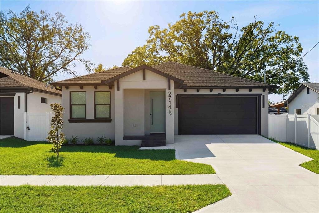 Front exterior of a new home in , Tampa, FL, highlighting curb appeal (Image 1). Front exterior of a new home in , Tampa, FL, highlighting curb appeal (Image 1).