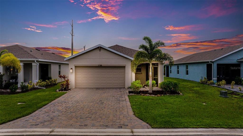 Front exterior of a new home in , North Fort Myers, FL, highlighting curb appeal (Image 1). Front exterior of a new home in , North Fort Myers, FL, highlighting curb appeal (Image 1).