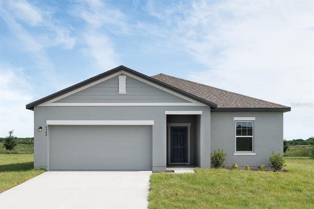 Front exterior of a new home in Sunset Hills, Winter Haven, FL, highlighting curb appeal (Image 1). Front exterior of a new home in Sunset Hills, Winter Haven, FL, highlighting curb appeal (Image 1).