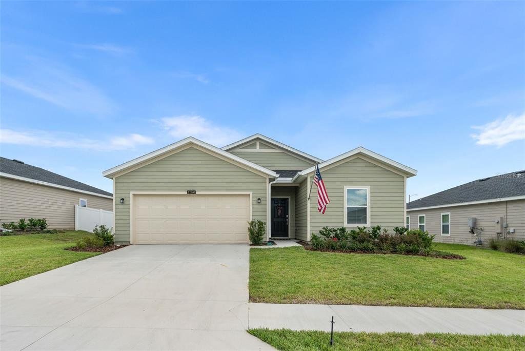 Front exterior of a new home in , Alachua, FL, highlighting curb appeal (Image 1). Front exterior of a new home in , Alachua, FL, highlighting curb appeal (Image 1).