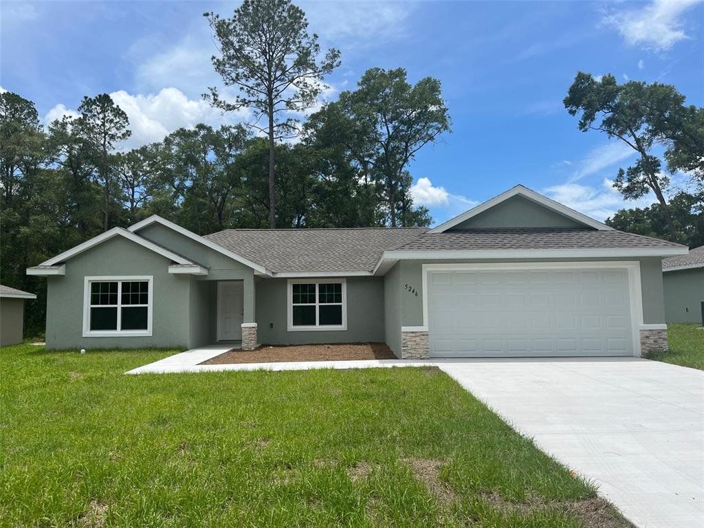 Front exterior of a new home in , Ocala, FL, highlighting curb appeal (Image 1). Front exterior of a new home in , Ocala, FL, highlighting curb appeal (Image 1).