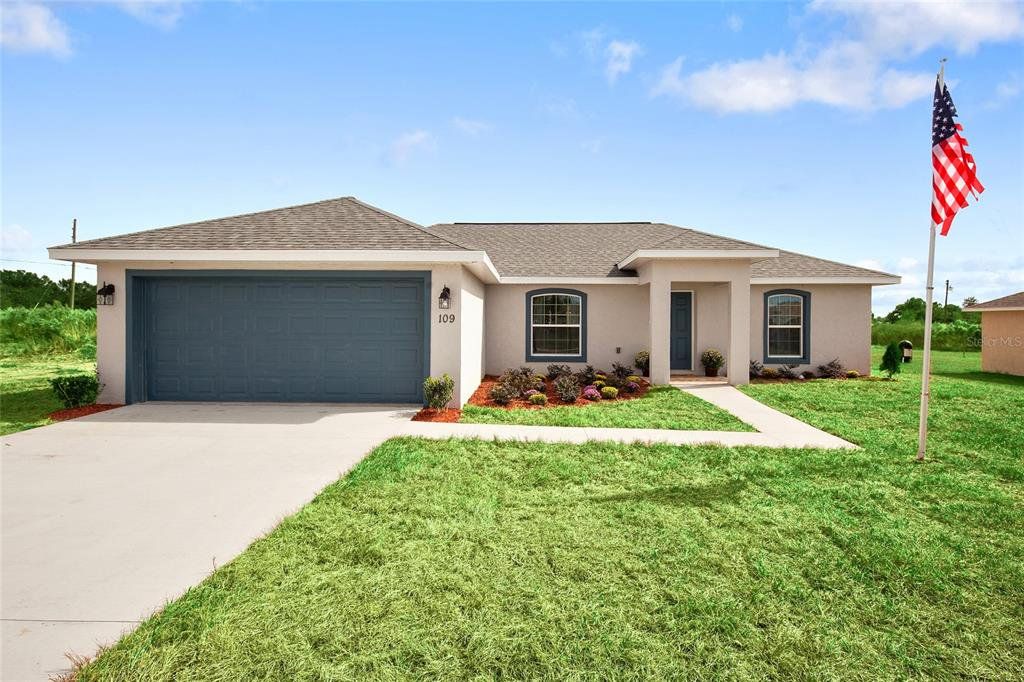 Front exterior of a new home in Silver Springs Shores, Ocala, FL, highlighting curb appeal (Image 1). Front exterior of a new home in Silver Springs Shores, Ocala, FL, highlighting curb appeal (Image 1).