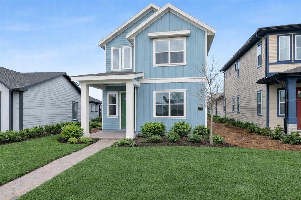 Front exterior of a new home in Weslyn Park at Sunbridge, St. Cloud, FL, highlighting curb appeal (Image 1). Front exterior of a new home in Weslyn Park at Sunbridge, St. Cloud, FL, highlighting curb appeal (Image 1).