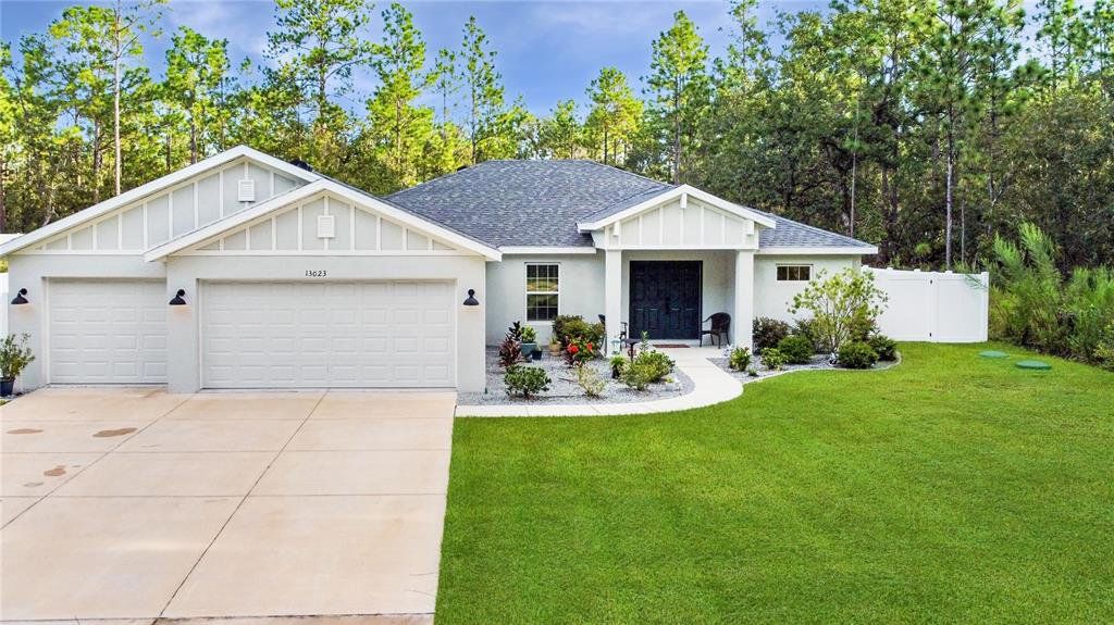 Front exterior of a new home in , Weeki Wachee, FL, highlighting curb appeal (Image 1). Front exterior of a new home in , Weeki Wachee, FL, highlighting curb appeal (Image 1).