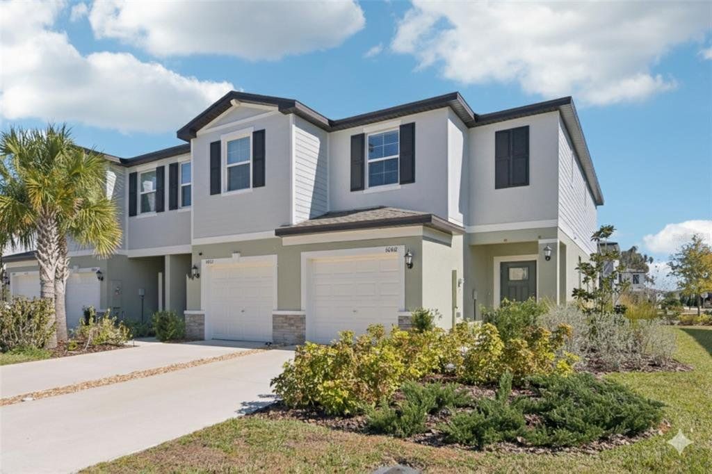 Front exterior of a new home in , Land O' Lakes, FL, highlighting curb appeal (Image 1). Front exterior of a new home in , Land O' Lakes, FL, highlighting curb appeal (Image 1).