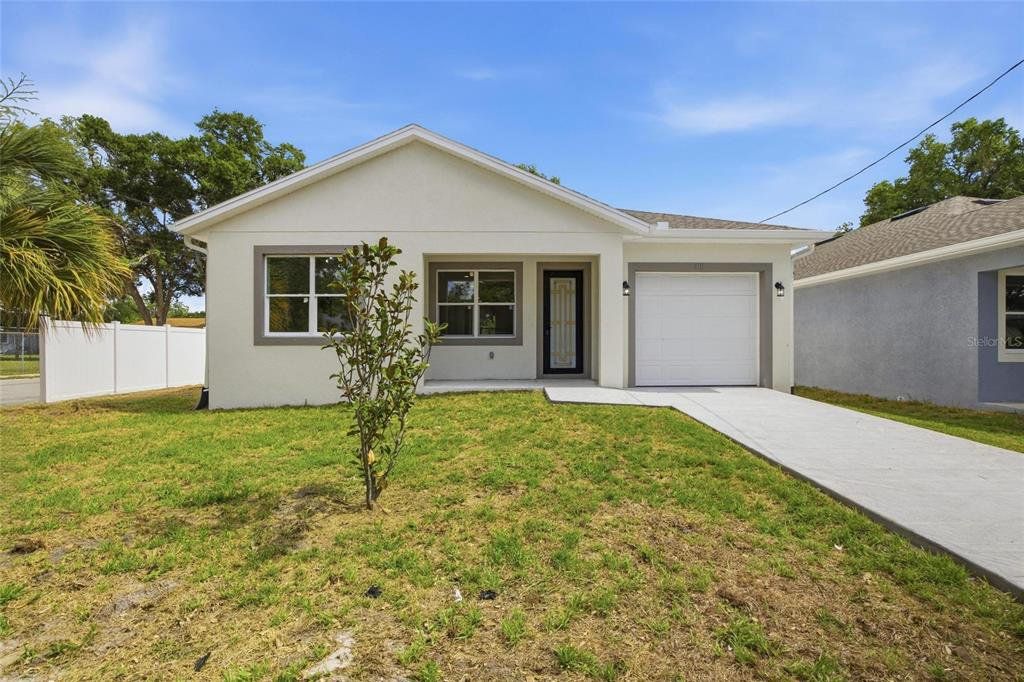 Front exterior of a new home in , Tampa, FL, highlighting curb appeal (Image 1). Front exterior of a new home in , Tampa, FL, highlighting curb appeal (Image 1).
