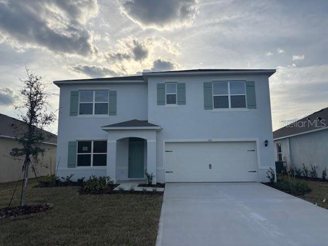 Front exterior of a new home in Groveside at Ormond Station, Ormond Beach, FL, highlighting curb appeal (Image 1). Front exterior of a new home in Groveside at Ormond Station, Ormond Beach, FL, highlighting curb appeal (Image 1).
