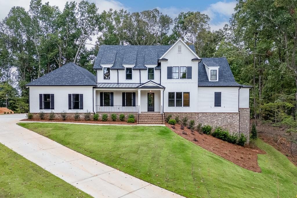 Front exterior of a new home in , Cumming, GA, highlighting curb appeal (Image 1). Front exterior of a new home in , Cumming, GA, highlighting curb appeal (Image 1).