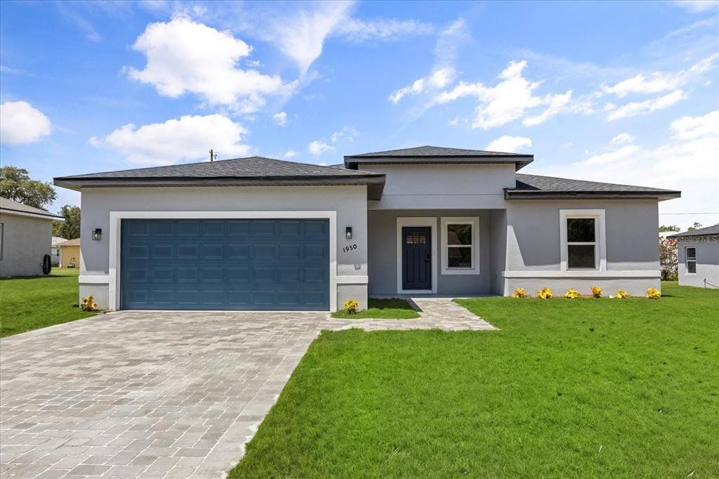 Front exterior of a new home in , Ocala, FL, highlighting curb appeal (Image 1). Front exterior of a new home in , Ocala, FL, highlighting curb appeal (Image 1).