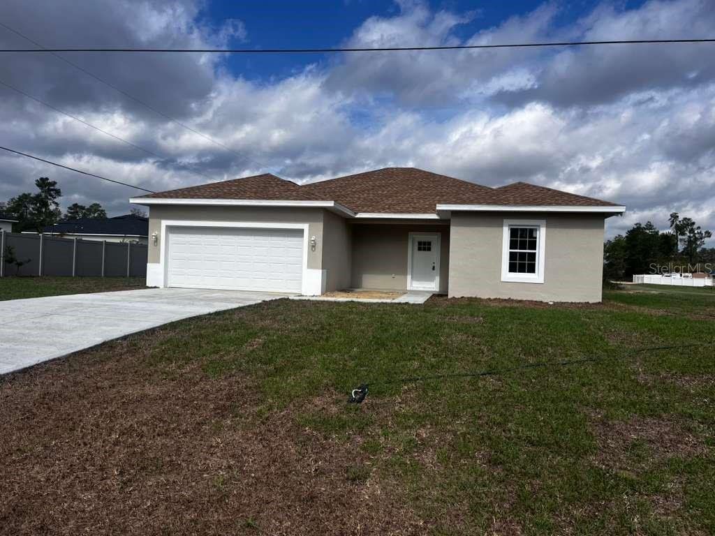 Front exterior of a new home in , Ocala, FL, highlighting curb appeal (Image 1). Front exterior of a new home in , Ocala, FL, highlighting curb appeal (Image 1).