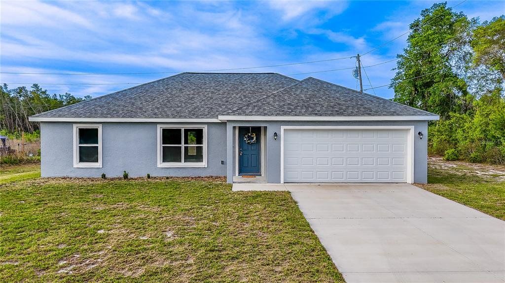 Front exterior of a new home in , Ocala, FL, highlighting curb appeal (Image 1). Front exterior of a new home in , Ocala, FL, highlighting curb appeal (Image 1).