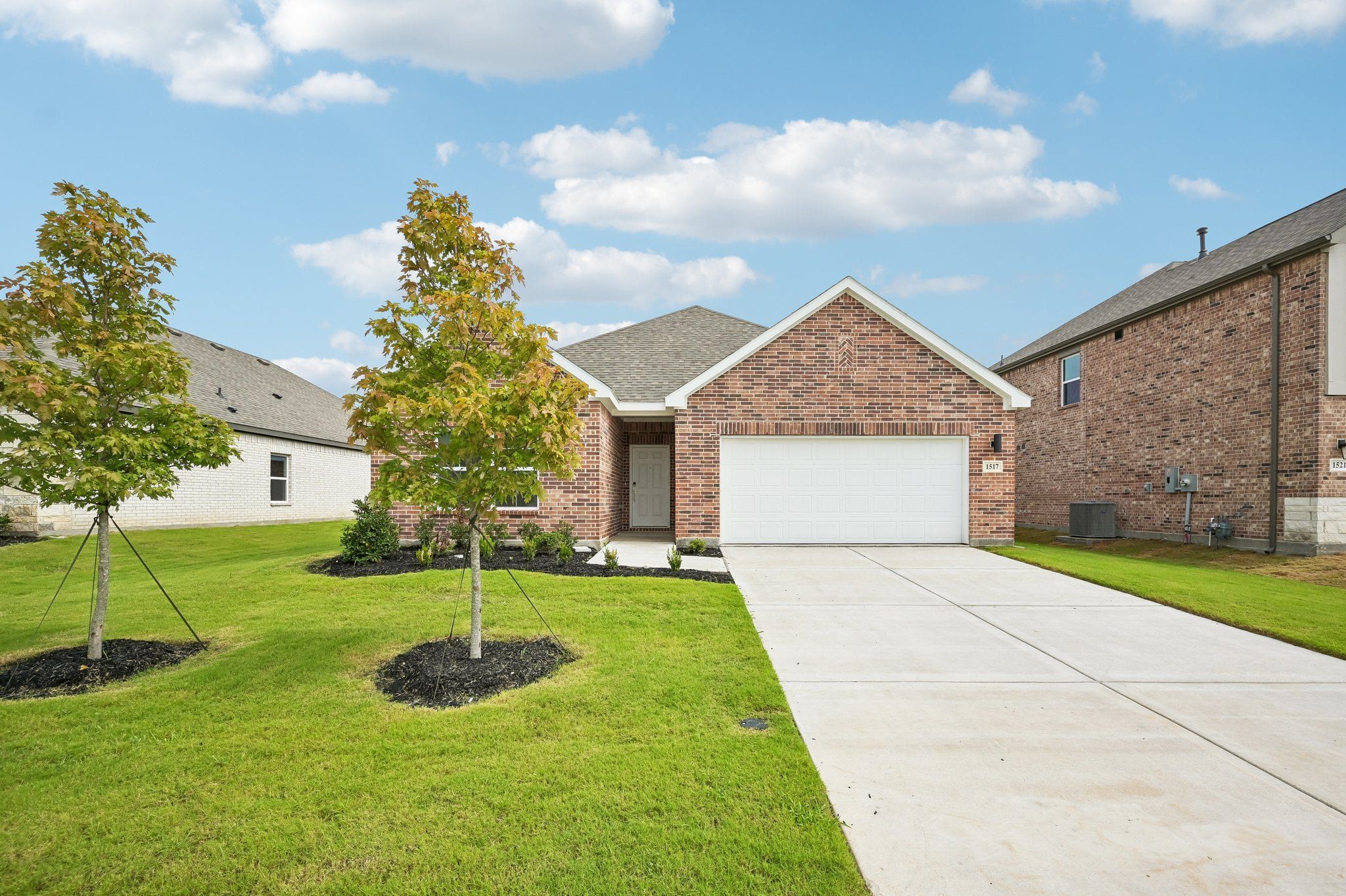 Front exterior of a new home in Anna Town Square, Anna, TX, highlighting curb appeal (Image 1). Front exterior of a new home in Anna Town Square, Anna, TX, highlighting curb appeal (Image 1).
