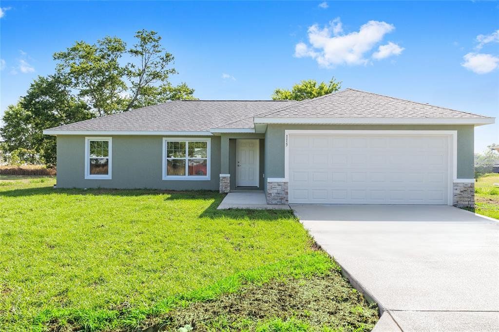Front exterior of a new home in , Dunnellon, FL, highlighting curb appeal (Image 1). Front exterior of a new home in , Dunnellon, FL, highlighting curb appeal (Image 1).