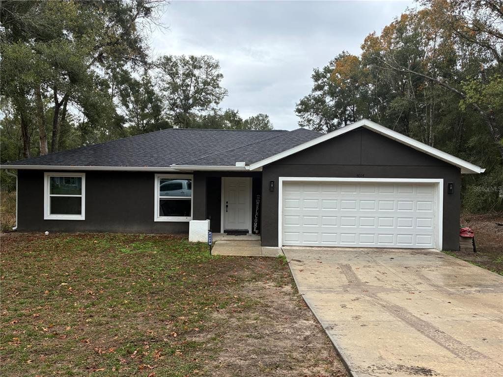Front exterior of a new home in , Summerfield, FL, highlighting curb appeal (Image 1). Front exterior of a new home in , Summerfield, FL, highlighting curb appeal (Image 1).