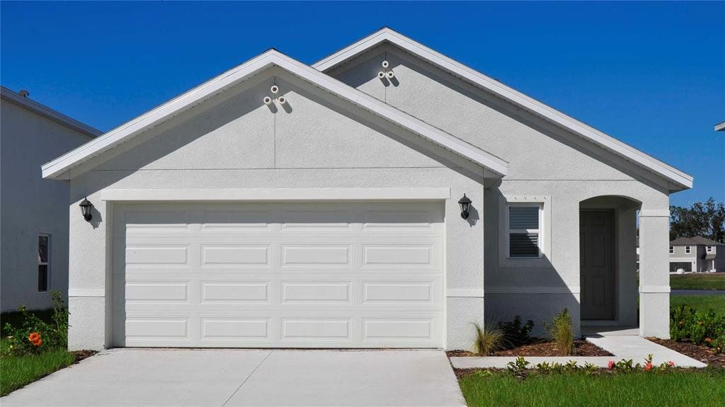 Front exterior of a new home in Oakfield Lakes, Parrish, FL, highlighting curb appeal (Image 1). Front exterior of a new home in Oakfield Lakes, Parrish, FL, highlighting curb appeal (Image 1).