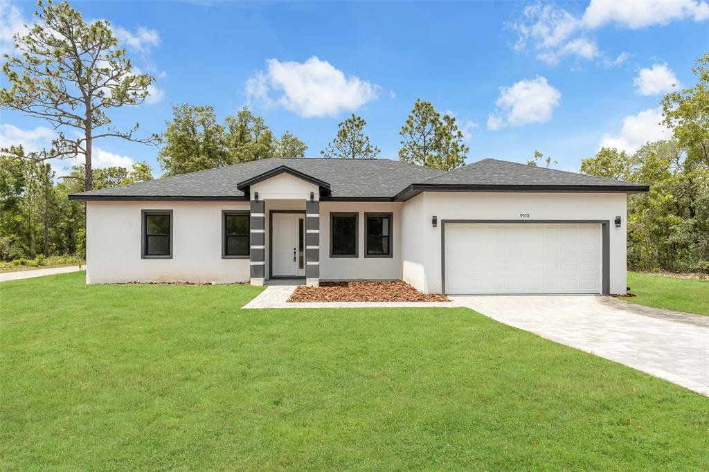 Front exterior of a new home in , Citrus Springs, FL, highlighting curb appeal (Image 1). Front exterior of a new home in , Citrus Springs, FL, highlighting curb appeal (Image 1).