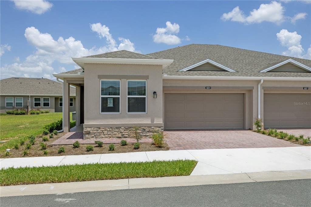 Front exterior of a new home in , Ocala, FL, highlighting curb appeal (Image 1). Front exterior of a new home in , Ocala, FL, highlighting curb appeal (Image 1).