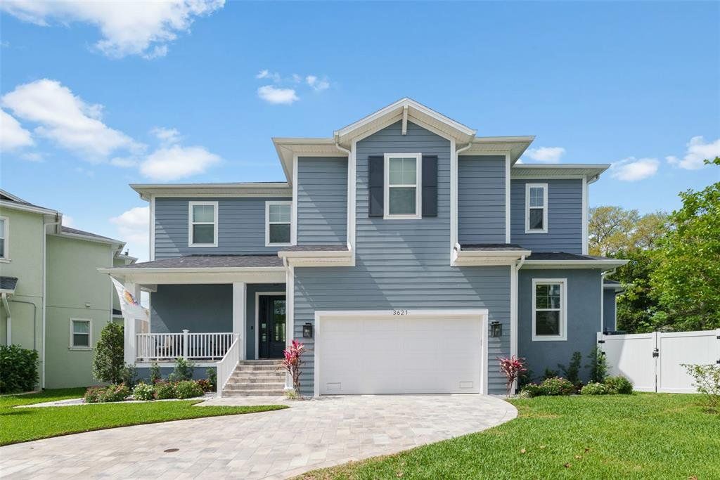 Front exterior of a new home in , Tampa, FL, highlighting curb appeal (Image 1). Front exterior of a new home in , Tampa, FL, highlighting curb appeal (Image 1).