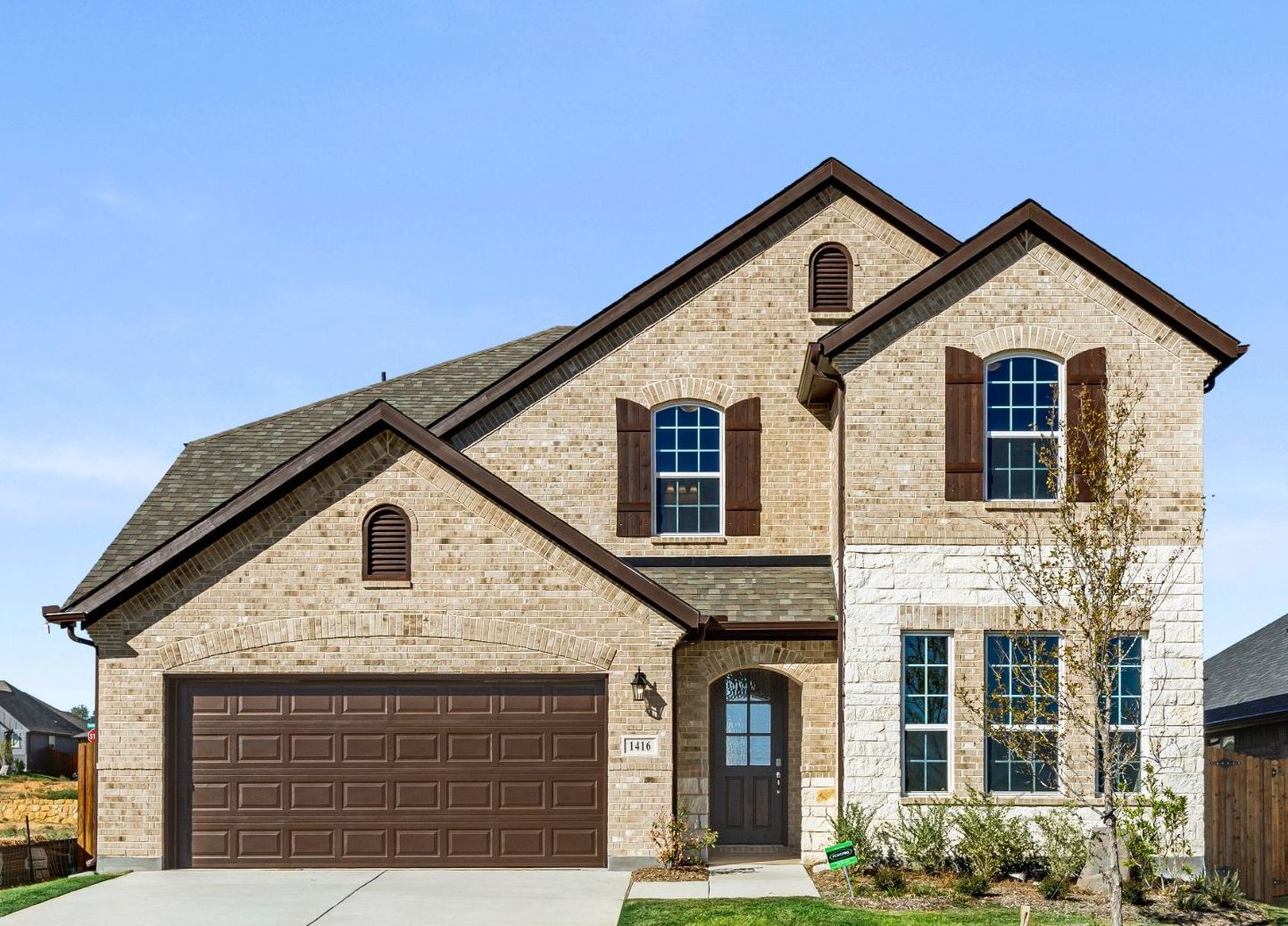 Representative exterior photo of a completed home built from the Nueces by UnionMain Homes in Brookville Estates, Forney, TX (Image 1).