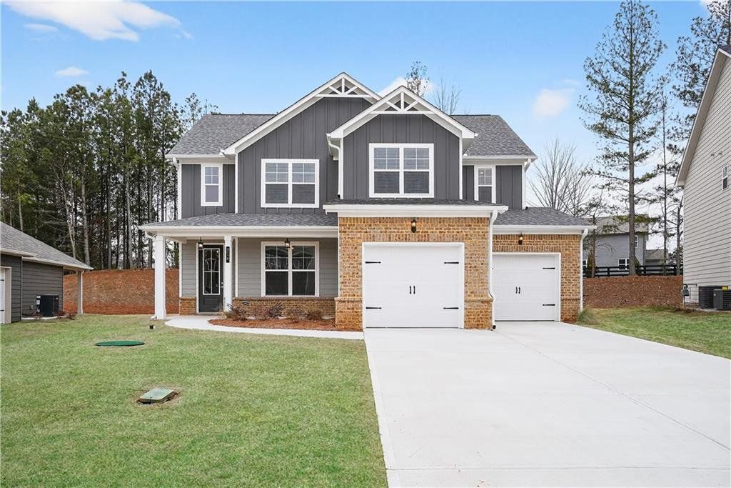 Front exterior of a new home in The Fairways at Mirror Lake, Villa Rica, GA, highlighting curb appeal (Image 1). Front exterior of a new home in The Fairways at Mirror Lake, Villa Rica, GA, highlighting curb appeal (Image 1).