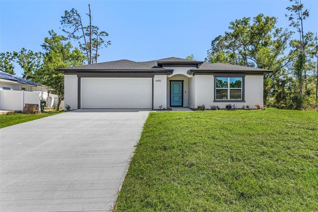 Front exterior of a new home in , North Port, FL, highlighting curb appeal (Image 1). Front exterior of a new home in , North Port, FL, highlighting curb appeal (Image 1).