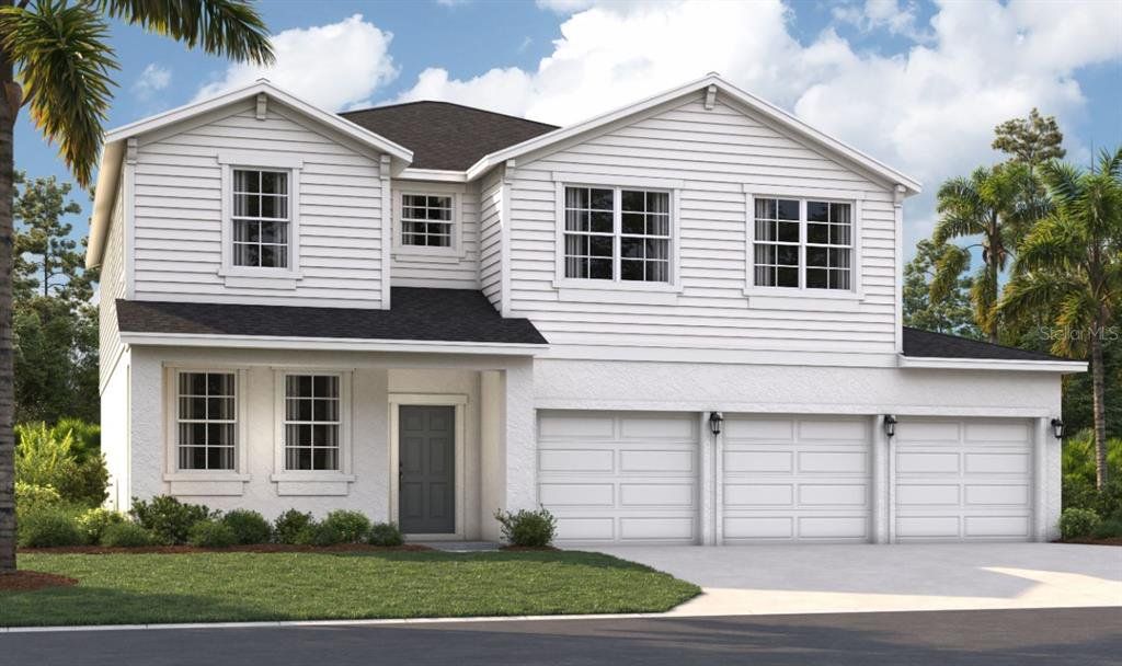 Front exterior of a new home in Groves at Grand Island, Grand Island, FL, highlighting curb appeal (Image 1). Front exterior of a new home in Groves at Grand Island, Grand Island, FL, highlighting curb appeal (Image 1).
