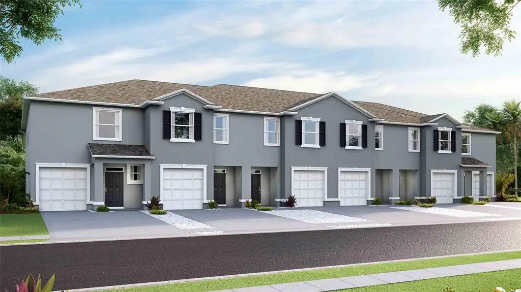 Front exterior of a new home in Meadow Ridge at Epperson, Wesley Chapel, FL, highlighting curb appeal (Image 1).
