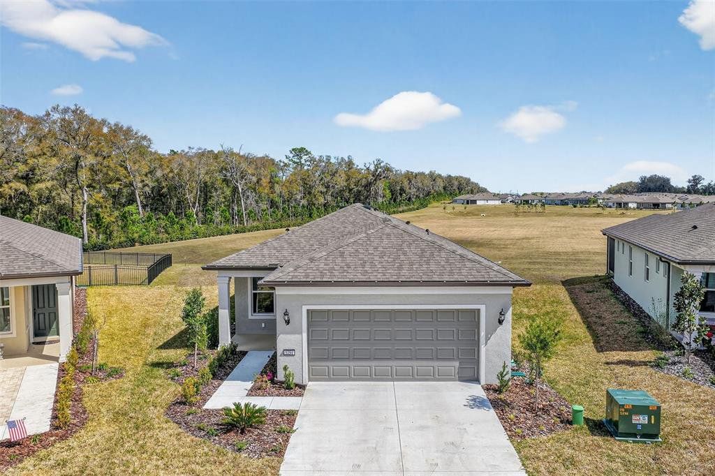 Front exterior of a new home in , Ocala, FL, highlighting curb appeal (Image 1). Front exterior of a new home in , Ocala, FL, highlighting curb appeal (Image 1).