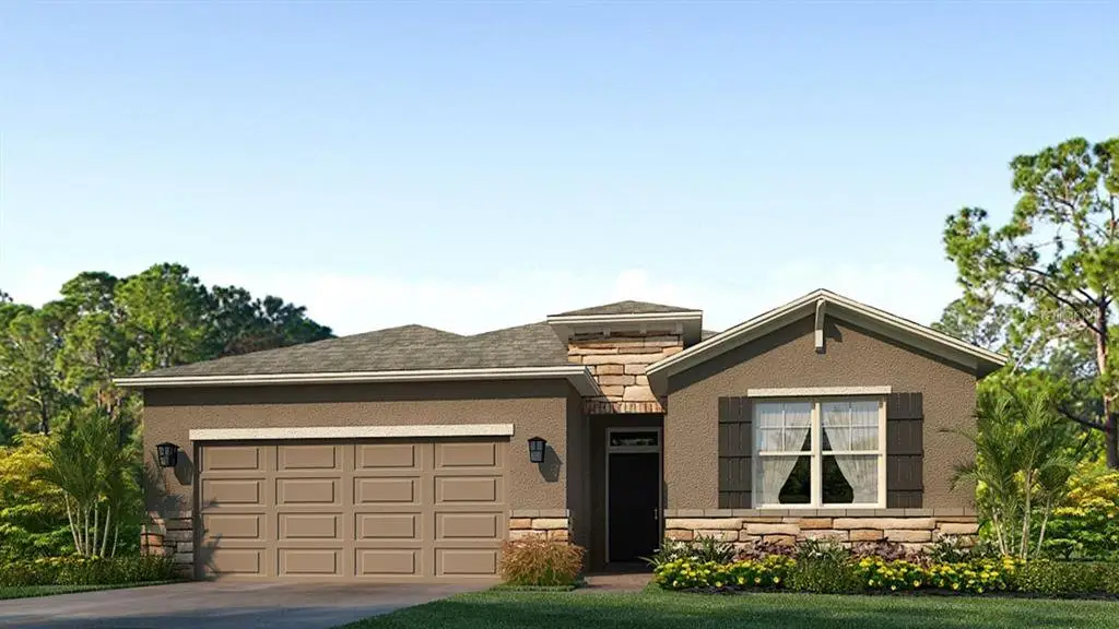Front exterior of a new home in Twisted Oaks, Wildwood, FL, highlighting curb appeal (Image 1).