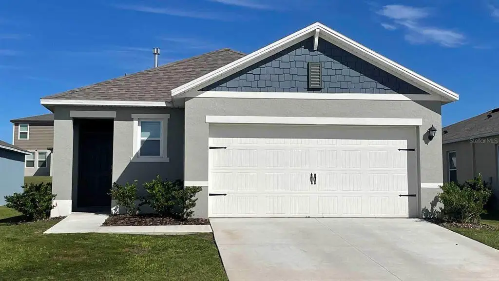 Front exterior of a new home in , Davenport, FL, highlighting curb appeal (Image 1). Front exterior of a new home in , Davenport, FL, highlighting curb appeal (Image 1).