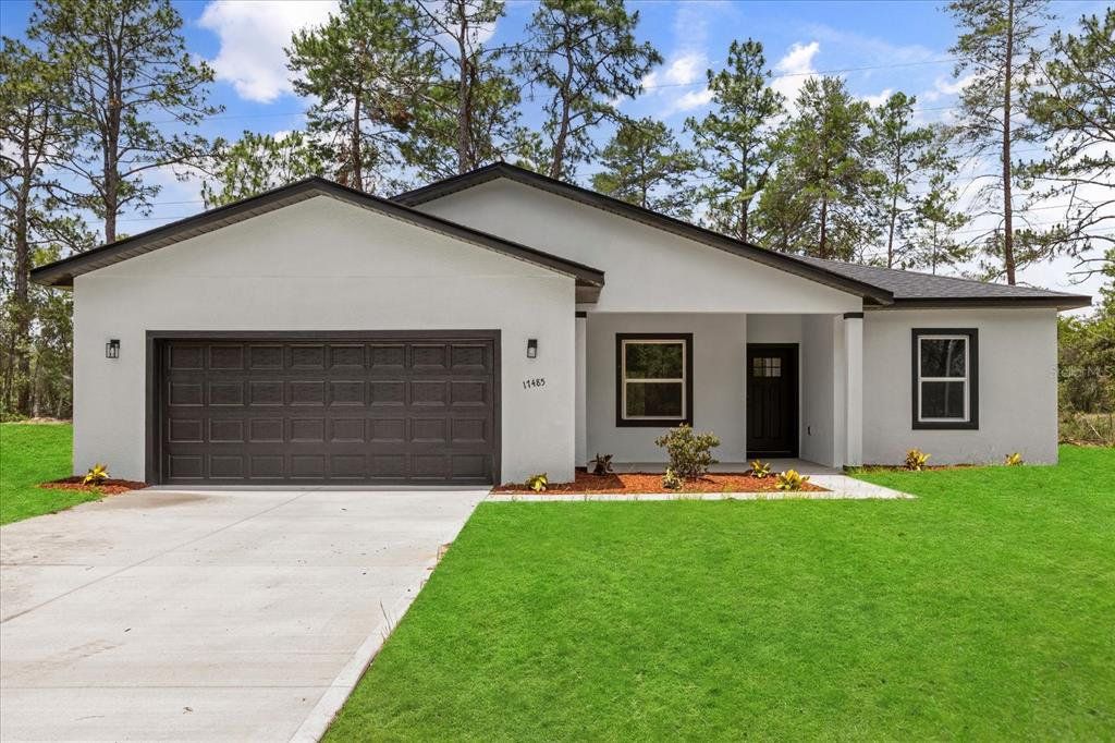 Front exterior of a new home in , Ocala, FL, highlighting curb appeal (Image 1). Front exterior of a new home in , Ocala, FL, highlighting curb appeal (Image 1).